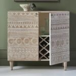 A distressed white hand-carved solid wood bar cabinet with 2 doors and an internal wine rack - Modera Furnish.