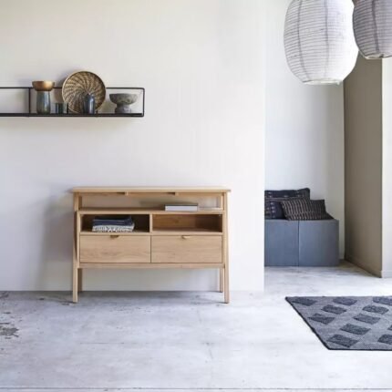 A natural light mango wood console table featuring two drawers with half-moon pulls and a tiered architectural design - Modera Furnish.