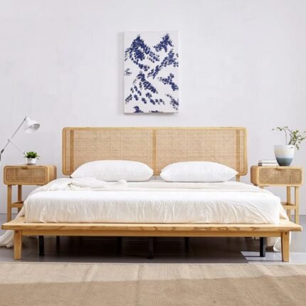 A natural light wood low-profile platform bed with a dual-panel hand-woven cane headboard - Modera Furnish.