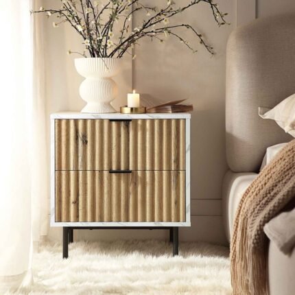 A contemporary white marble effect bedside table with two fluted oak drawers and black metal legs - Modera Furnish.