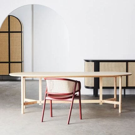 A walnut and black solid mango wood dining chair with a hand-woven cane backrest and tapered legs - Modera Furnish.