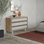 A natural mango wood chest of drawers with three wide storage drawers and curved side panels - Modera Furnish.