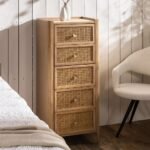A natural vertical solid wood chest of drawers featuring five drawers with hand-woven cane front panels - Modera Furnish.