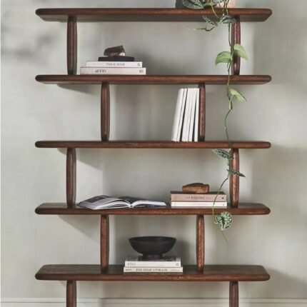 A natural solid wood bookshelf featuring six staggered floating tiers with rounded edges and offset supports - Modera Furnish.