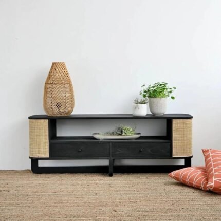 A black solid wood TV unit featuring two central drawers and curved side panels with natural cane mesh - Modera Furnish.