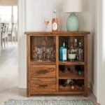 A natural solid sheesham wood bar cabinet with two drawers and integrated wine storage racks - Modera Furnish.