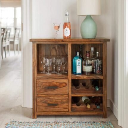 A natural solid sheesham wood bar cabinet with two drawers and integrated wine storage racks - Modera Furnish.