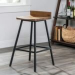 A black solid wood and metal bar stool featuring a low backrest and an industrial-style reinforced frame - Modera Furnish.