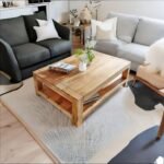 A natural finish solid acacia wood coffee table featuring a storage shelf and a minimalist 120 cm rectangular profile - Modera Furnish.