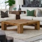 A natural finish solid wood square coffee table with bold block legs and a 105 cm surface - Modera Furnish.