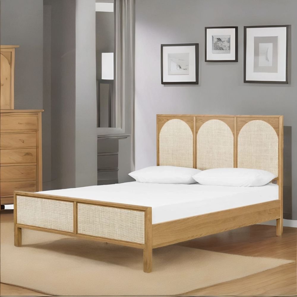 1 A natural finish hardwood king-size bed featuring a high three-paneled arched headboard with hand-woven rattan inlays - Modera Furnish.