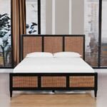 A black finish hardwood king-size bed featuring a high three-paneled headboard with natural cane inlays - Modera Furnish.