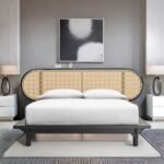 A black finish hardwood double bed featuring a large oval headboard with natural cane inlays - Modera Furnish.