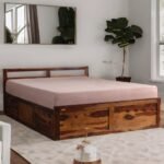 A queen-size sheesham wood bed featuring integrated box storage and a warm teak finish - Modera Furnish.