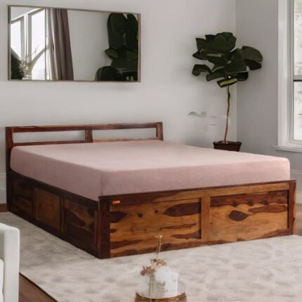 A queen-size sheesham wood bed featuring integrated box storage and a warm teak finish - Modera Furnish.