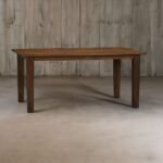 A walnut finish solid wood dining table with a 65-inch surface and robust corner legs - Modera Furnish.