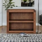 A golden honey mango wood low-profile bookcase with two wide open storage shelves - Modera Furnish.