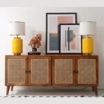 A long brown solid mango wood cabinet with four doors featuring hand-woven cane panels and circular metal pulls - Modera Furnish.