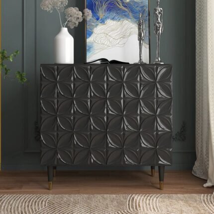 A bold obsidian black avant-garde media storage accent cabinet featuring high-relief 3D carved door patterns and tapered wood legs - Modera Furnish.
