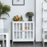 A white 2 door glass storage cabinet with a window-pane design and metallic knobs - Modera Furnish.