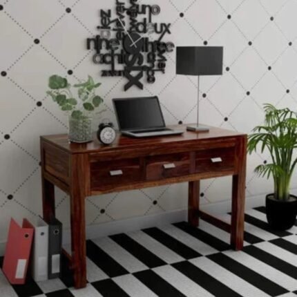 A sophisticated walnut finish solid sheesham wood study desk featuring a triple-drawer storage configuration and a hand-carved artisanal frame - Modera Furnish.