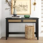 A black finish solid wood console table featuring two front drawers with breathable natural cane inlays - Modera Furnish.