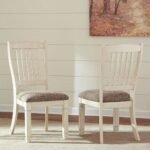 An antique off-white solid wood dining chair set featuring a slat-back design and textured fabric seats - Modera Furnish.