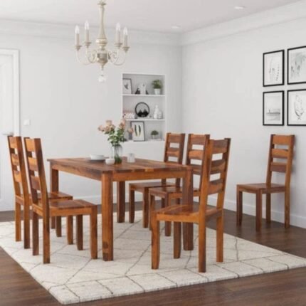 A six-seater sheesham wood dining set in a walnut finish featuring a 62-inch table and slat-back chairs - Modera Furnish.