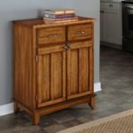 A brown oak storage cabinet featuring two top drawers and two lower paneled doors with antique hardware - Modera Furnish.