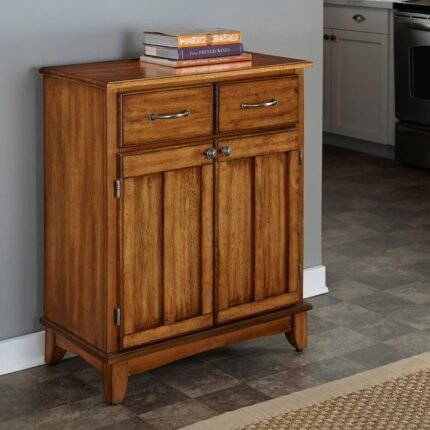 A brown oak storage cabinet featuring two top drawers and two lower paneled doors with antique hardware - Modera Furnish.