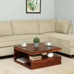 A 30-inch square solid Sheesham wood coffee table featuring a multi-tier cantilever storage design, honey walnut finish, and rich natural grain - Modera Furnish.