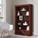 A grand deep brown solid wood bookshelf featuring five tiers of open storage and two lower drawers with metal handles - Modera Furnish.
