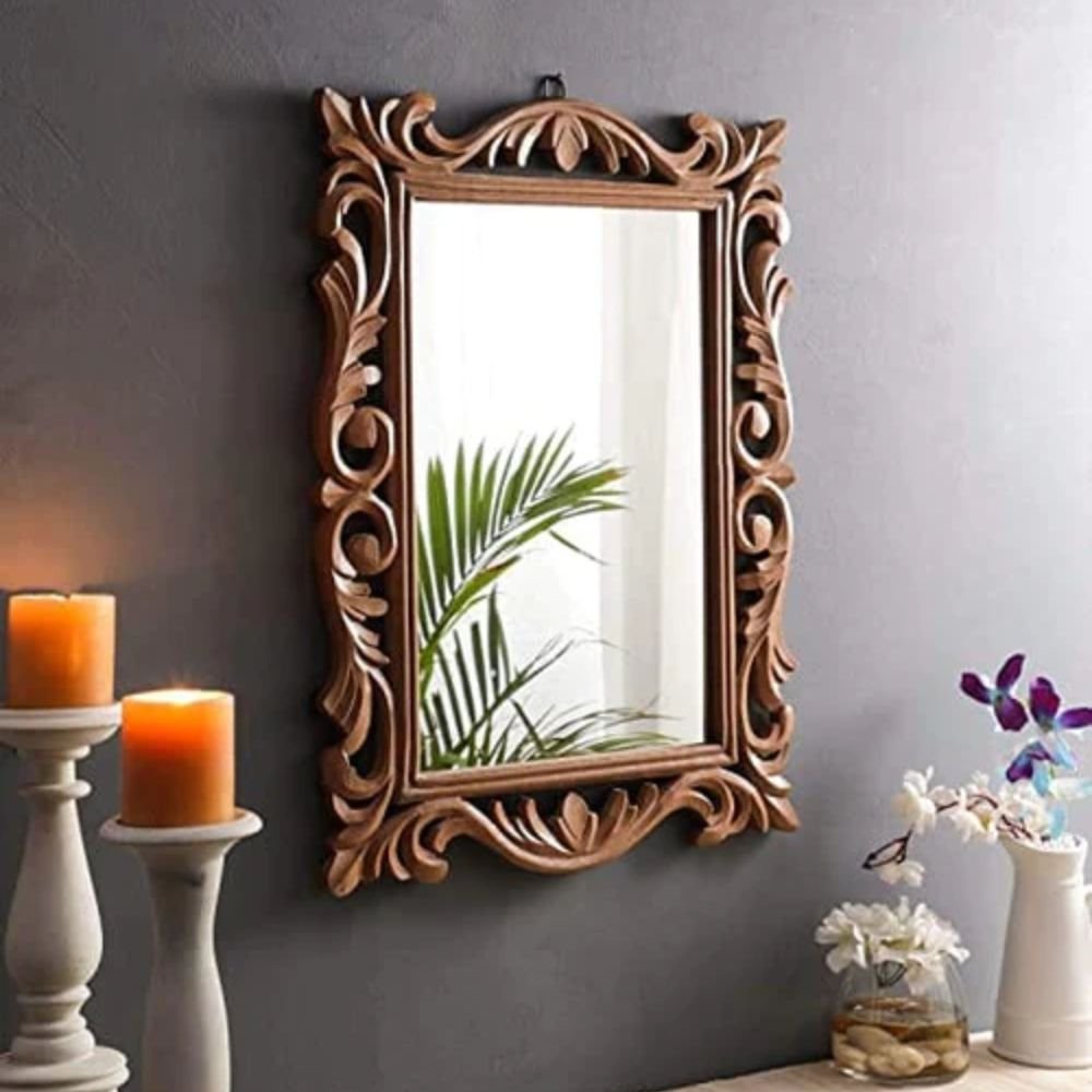 1 A handcrafted brown polished wood wall mirror with intricate ornate scrollwork and floral carvings - Modera Furnish.
