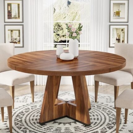 Solid wood round dining table with sculptural pedestal base in a warm brown finish for modern dining rooms – Modera Furnish