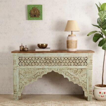 A sage green hand-carved solid mango wood console table with a floral lattice front and natural wood top - Modera Furnish.