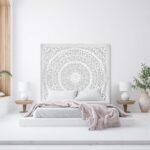 A large white hand-carved solid wood bed headboard for king size beds with intricate circular patterns - Modera Furnish.