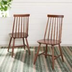 A modern dining chair crafted from warm solid walnut wood featuring a distinct slatted backrest design in this elegant solid walnut slatted dining chair - Modera Furnish.