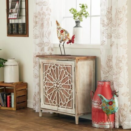 A distressed antique white and brown storage cabinet featuring two doors with a geometric medallion overlay and minimalist knobs - Modera Furnish.