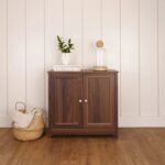 A rich brown 2 door solid wood sideboard cabinet featuring framed door panels and metallic knobs - Modera Furnish.