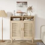 A natural light wood storage cabinet featuring two doors with woven cane panels, minimalist wood handles, and an open top shelving unit - Modera Furnish.