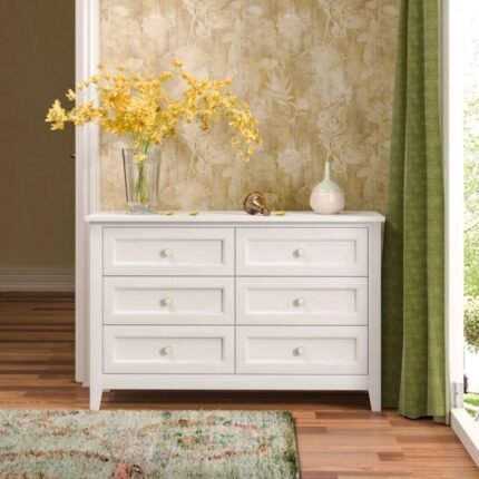 A white rectangular solid wood chest of drawers featuring a distressed finish and six spacious storage drawers - Modera Furnish.