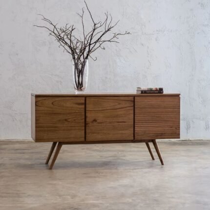 A natural brown finish solid wood cabinet featuring three storage doors and mid-century splayed legs - Modera Furnish.