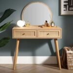 A natural wood-effect dressing table featuring two hand-woven rattan drawers and a matching round mirror - Modera Furnish.