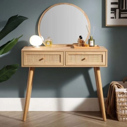 A natural wood-effect dressing table featuring two hand-woven rattan drawers and a matching round mirror - Modera Furnish.