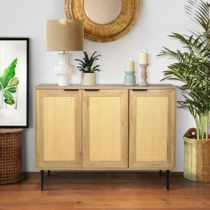 A light wood storage cabinet featuring three woven rattan doors and black metal legs for modern home organization - Modera Furnish.