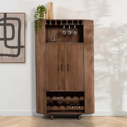 A large brown solid mango wood bar cabinet featuring fluted doors, integrated wine glass racks, and open bottle storage tiers - Modera Furnish.