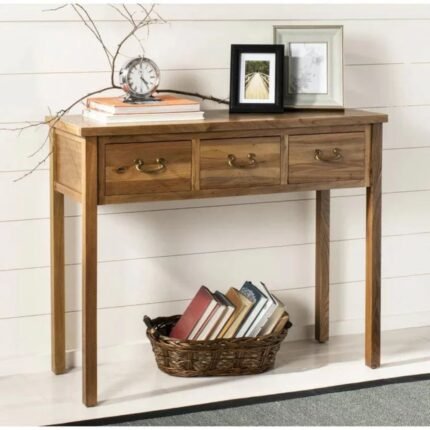 A natural oak color solid wood console table featuring three drawers with antique brass handles and elegant tapered legs - Modera Furnish.