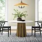 Solid wood round pedestal dining table in white finish with contemporary design - Modera Furnish