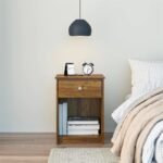 A brown solid wood bedside table featuring a single drawer and an open lower storage compartment - Modera Furnish.
