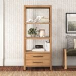 Solid wood bookshelf with open shelving and two drawers in a natural finish for organized modern interiors - Modera Furnish